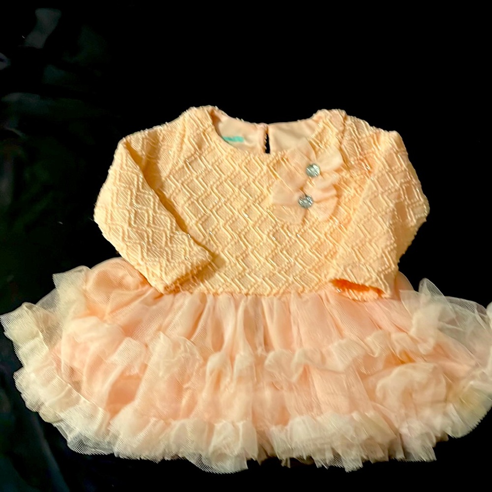 I’m selling a 3/6 month old light pink dress from Nannette